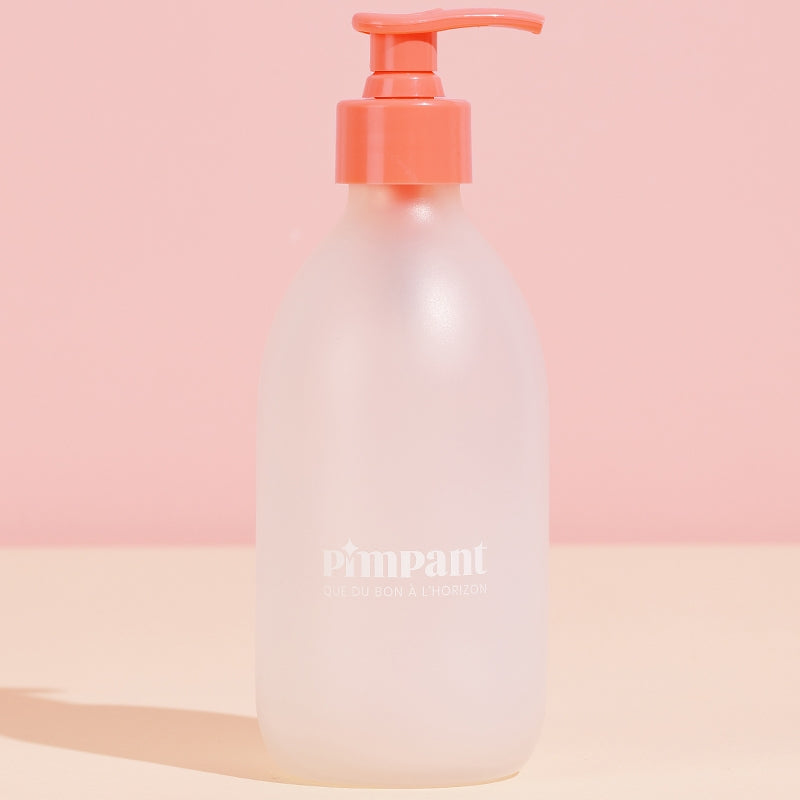 Bouteille en verre avec pompe rose (vide)